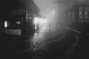 A foggy wet dark street