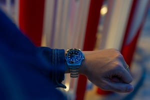 Man showing off his Rolex Watch