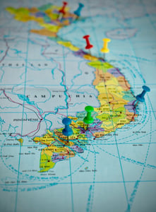 Green and Blue Pushpins on Vietnam Map
