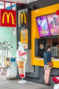 A girl ordering at McDonald