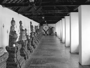 Corridor with buddha statues in That Luang