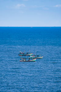 3 fishing boats in the ocean