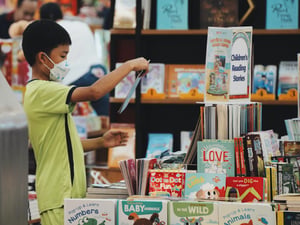 A boy choosing a children book