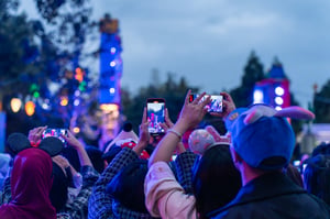 Young people taking videos at an event