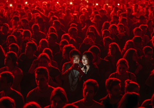 A couple checking social media during an event