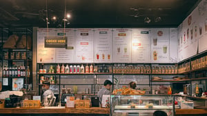 A menu & counter in a coffee shop