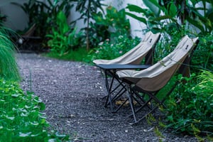 Couple Relaxing Chairs in a Garden