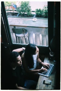 A couple working at coffee shop