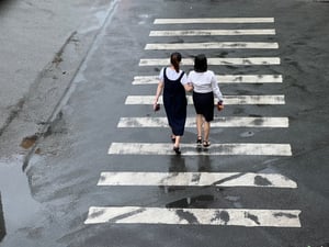 Office-worker crossing the street